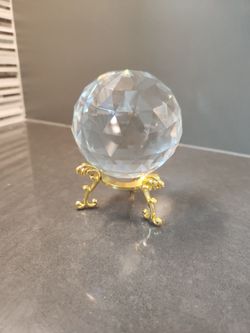 Faceted crystal orb and gold stand