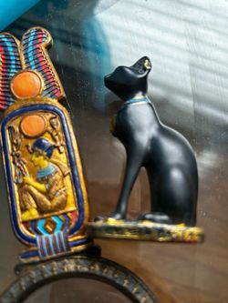 Egyptian cat bastet and hieroglyph magnifying glass