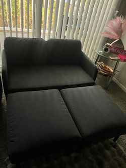 Grey ikea chair with ottomans
