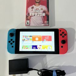 Nintendo Switch System / Console - Works Good - Includes Fifa Game - Charger . System has some scratches on the system but overall works fine :) 
