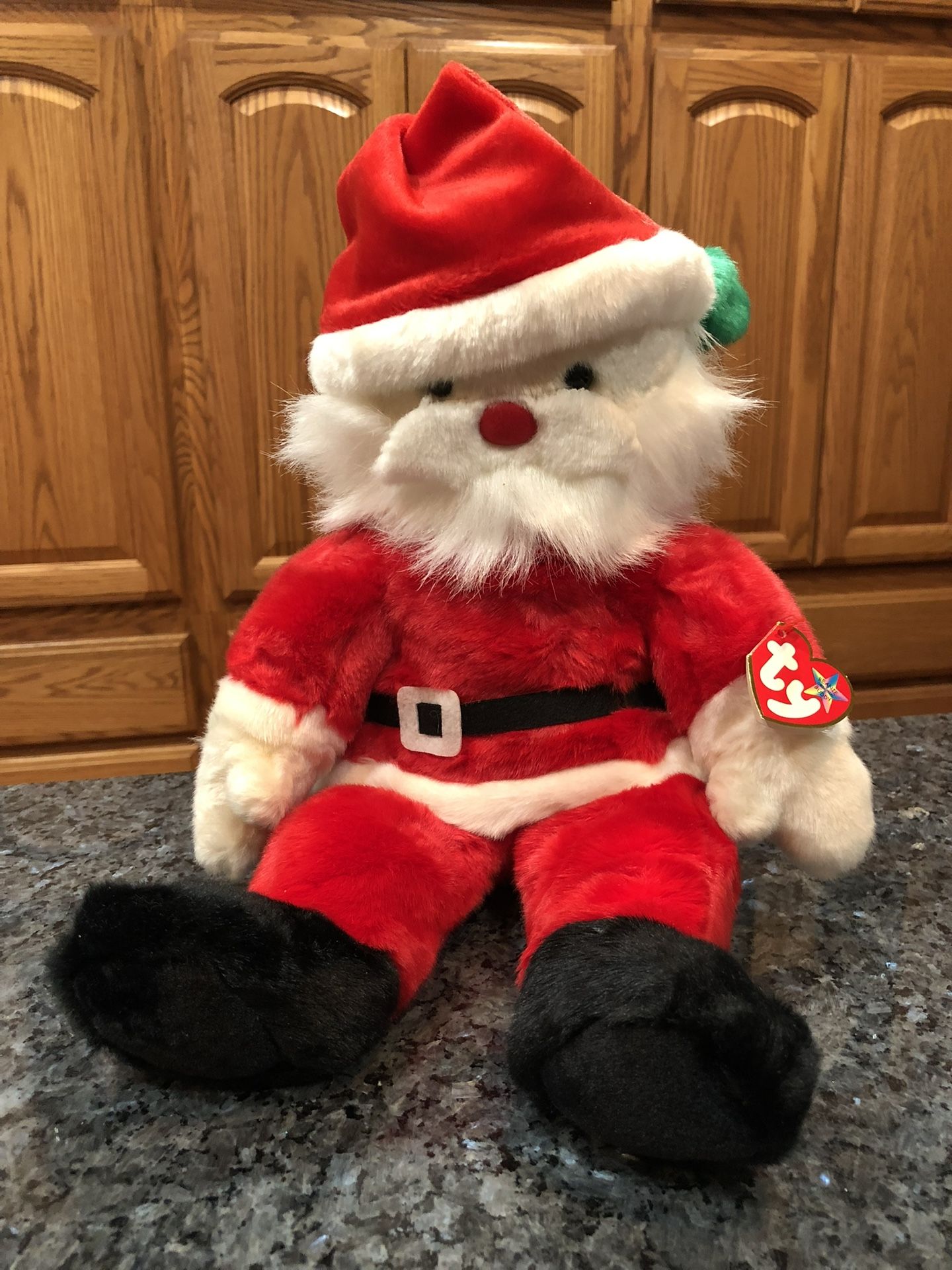 Ty Buddy Beanie Babie “Santa” Year 2000. Size 14 inches tall. Sits up. Brand New with Tags has been on display in a cabinet with a Ty beanie Babie