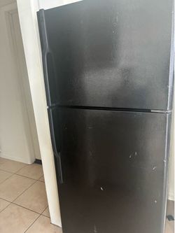 Working black refrigerator