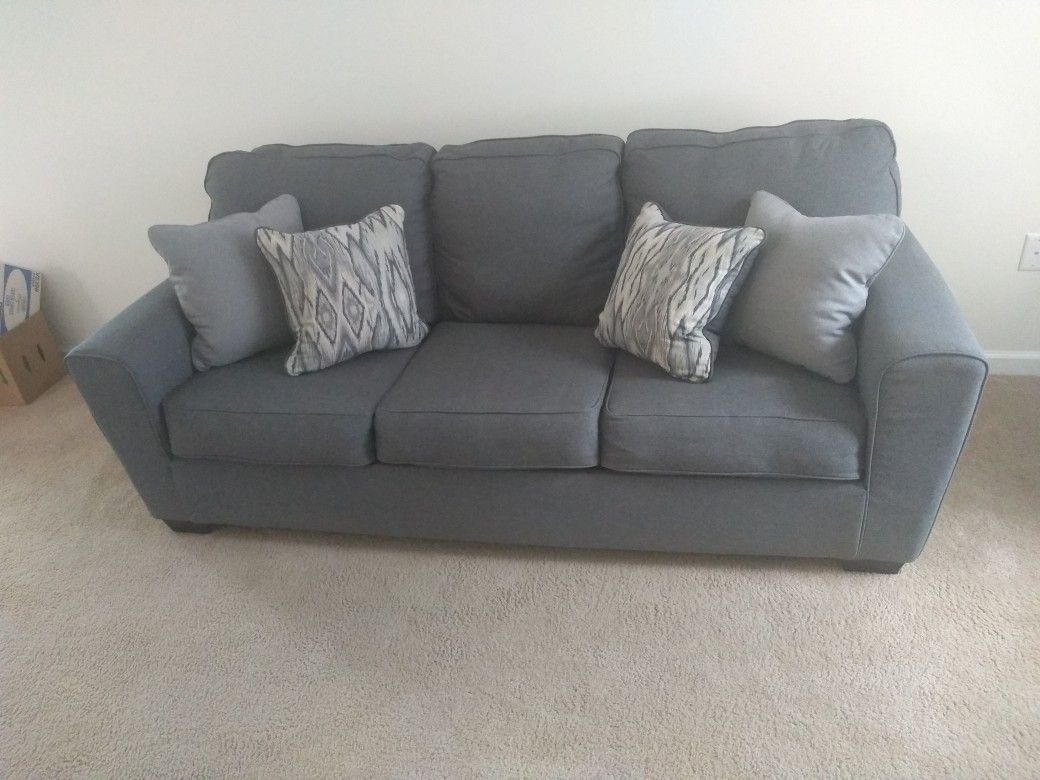 Blue Sofa With Throw Pillows 