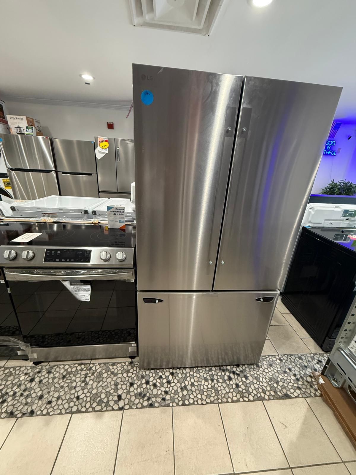 LG Refrigerator French Door & Electric Slide Stove In Stainless Steel
