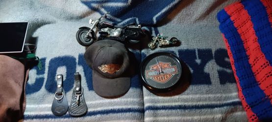 Harley-Davidson stuff a cap a clock two toy Harley-Davidson motorcycles and two key holders to hold your keys on your belt