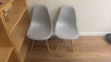 Grey ikea like eames mid century modern chairs