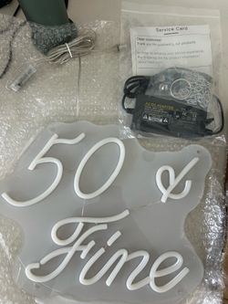 50 and fine neon light up sign.
