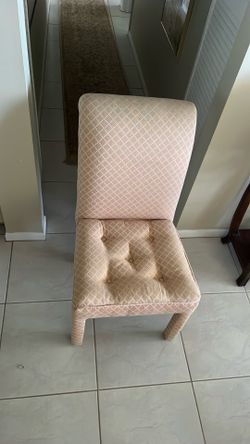 Four recovered designer chairs for a dining room table