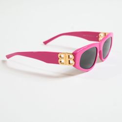 Sunglasses with a gold logo. Brand new.