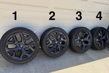 Set of four Rivian 22” Sport Dark rims and Toyo Open Country AT3 tires