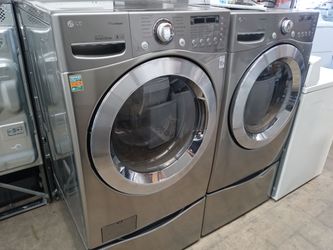 LG gray front load washer and dryer set on pedestals - Free delivery