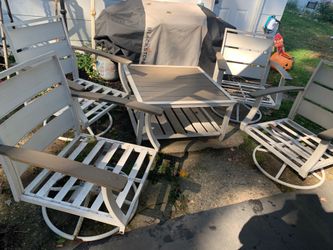 Must go asap $30. Price is Firm. Outdoor swivel chairs and table (coffee table height) great for around fire pit