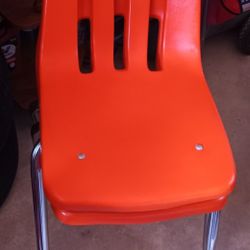 2 Orange Kids Chairs, Will Hold Adults As I've Sat In Them.