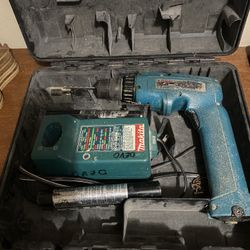 Makita vintage drill with batteries in a DeWALT case 