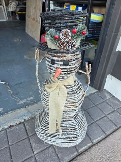 Pottery Barn Snowman lights up made of wooden sticks