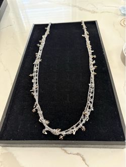 Elegant Silvertone bracelet, 34 inch in length