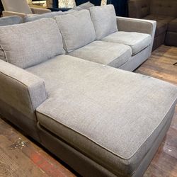Light Gray L-Shaped Sectional w/ Chaise – Modern & Comfy (WE DELIVER + WE HAUL AWAY OLD COUCHES)