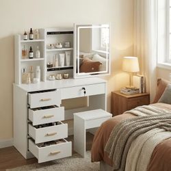 Vanity Table Featuring a Sliding Mirror And Lighting Options,