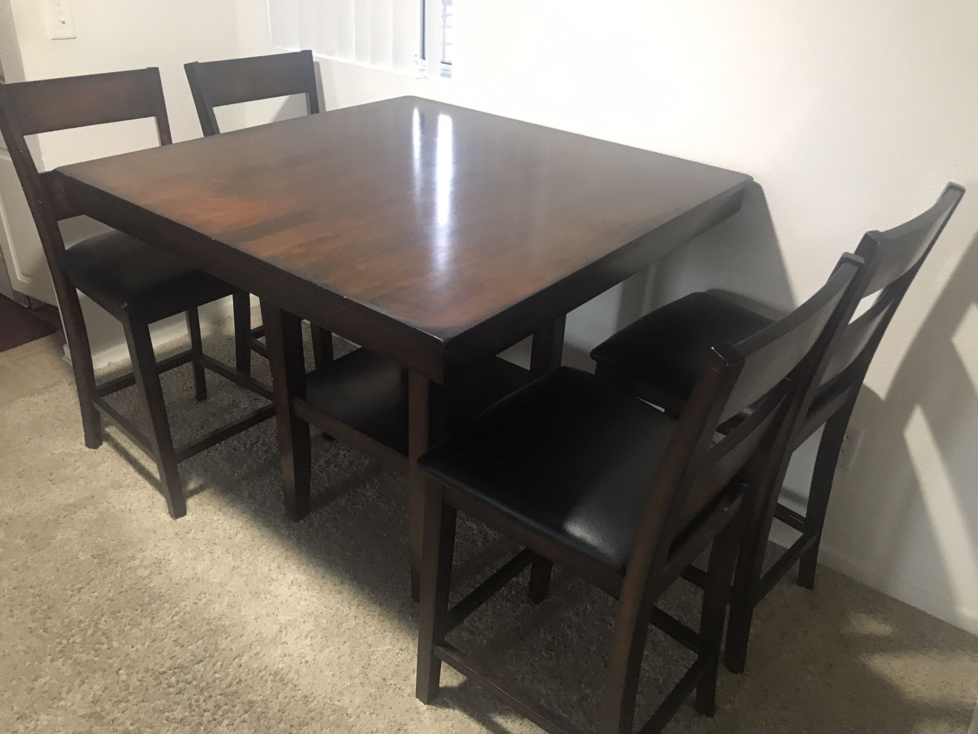 Dark brown counter height dining table with 4 chairs