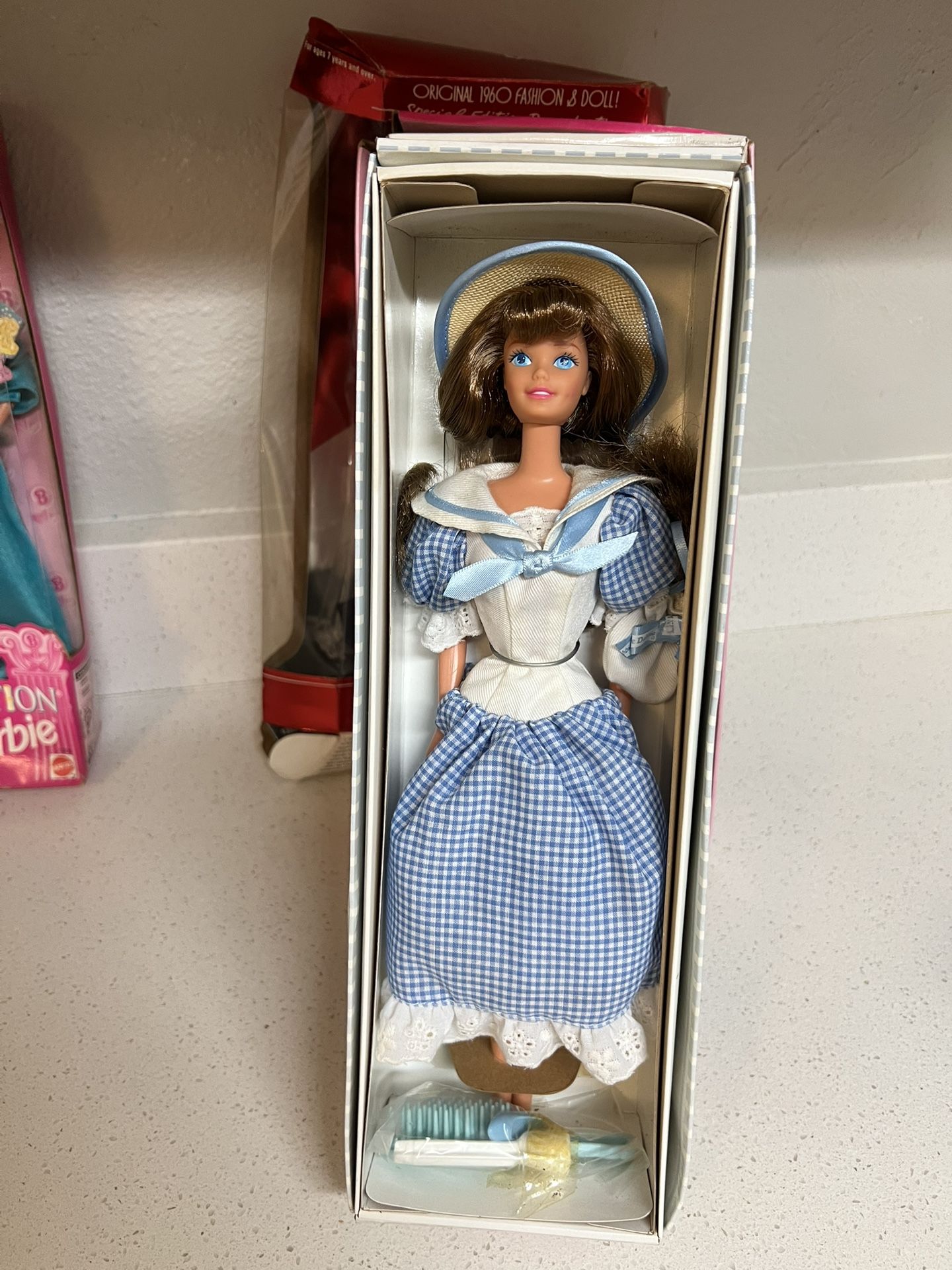1997 Mattel Little Debbie Barbie Collector's Edition Series III doll, number 16352. The doll wears a blue gingham dress, a straw hat with a blue band
