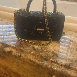 This is a Rebecca Minkoff Top Handle Chain Quilt Leather Crossbody bag in black leather with gold Hardware