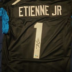 Travis Etn Autographed Jersey 