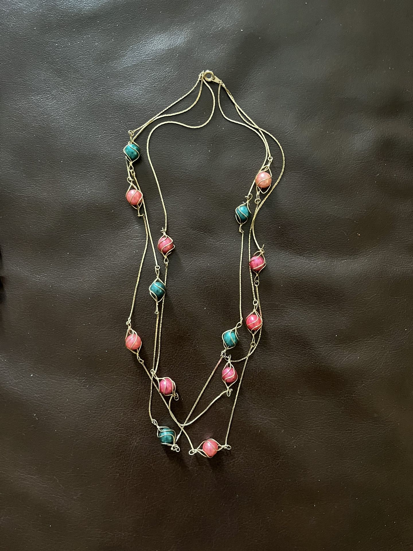 Pink and Teal Beads On A Gold Chain 