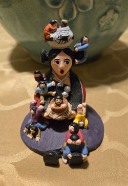 Pueblo-style Storyteller Figurine Central female figure surrounded by children.