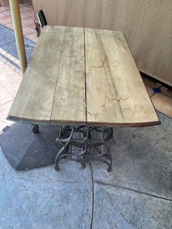 Old Trettle sewing machine base with wood top