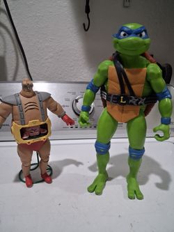 Ninja turtle action figure 12 inches tall, and a NECCA Teenage mutant ninja  turtles Krang's Android body ultimate action figure.  ( missing a hand)..
