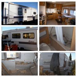 Damaged 2001 Coachman 26 ft. Travel Trailer