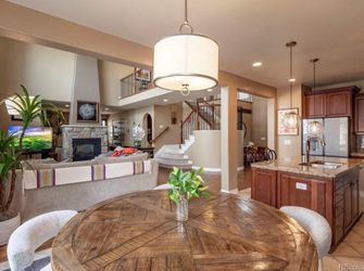 Elegant Farmhouse Round Wood Table and new soft contemporary plush chairs