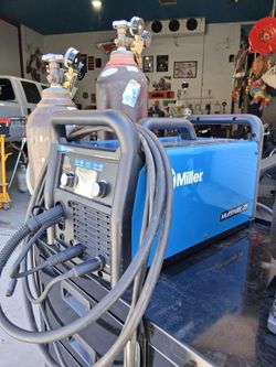 Miller Multimatic 215 w/ cart and bottles.