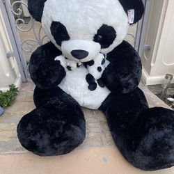 Huge panda bear with babies