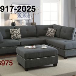 BLUE GRAY SECTIONAL WITH REVERSIBLE CHAISE. OTTOMAN INCLUDED