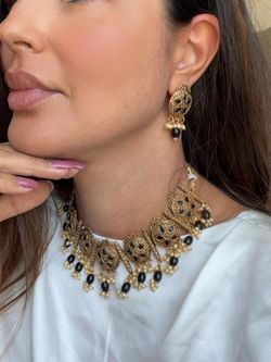 Gold & black jewelry set with intricate filigree and beadwork