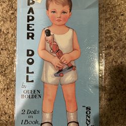 New in sealed package Queen Holden paper dolls 2 dolls in 1 book 