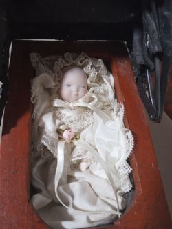 Porcelain Doll In Baby Buggy