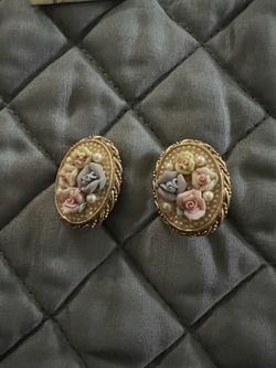 vintage-inspired oval earrings are from the renowned 1928 Jewelry Company, featuring a classic Victorian Revival style.