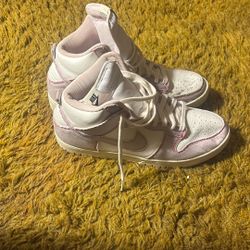 Nike Dunk Highs in a pink-stitched / light pink & white