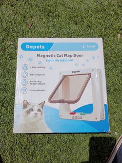 Magnetic cat flap door