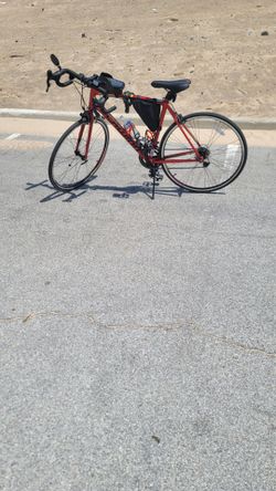 Red Schwinn men's 10 speed bike