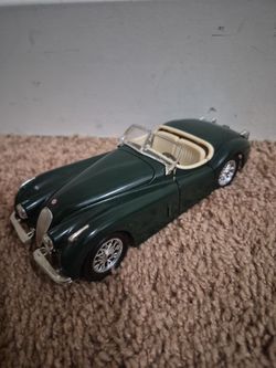 Vintage Jaguar X-K one twenty diecast model car, green."