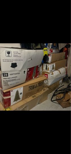 11 to 12 artificial Christmas tree trees in boxes with decorations