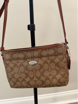 Elegant coach crossbody bag with electric pattern