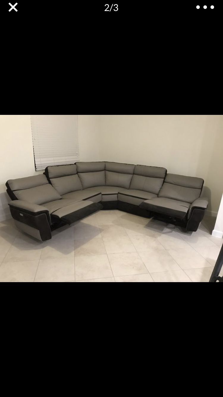 High end Leather section couch electric reclining end. 1 year old Must sell moving