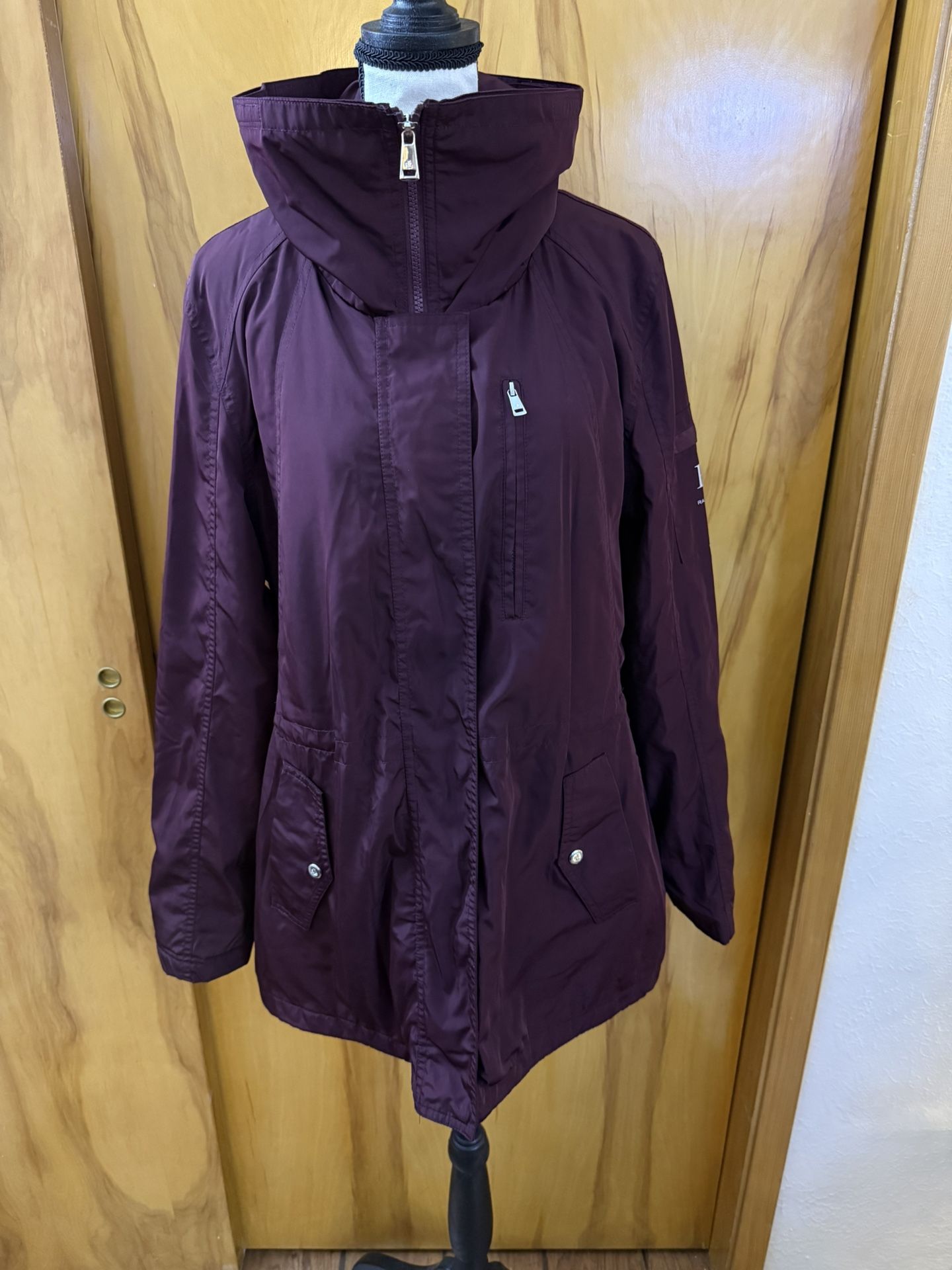 Ralph Lauren burgandy women’s rain Jacket or parka with a hood and drawstring waist Large on tag In very good condition