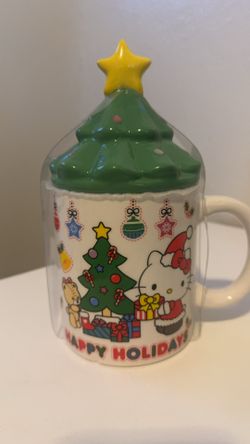 Hello kitty tea cup new with lid, still sealed and packaged