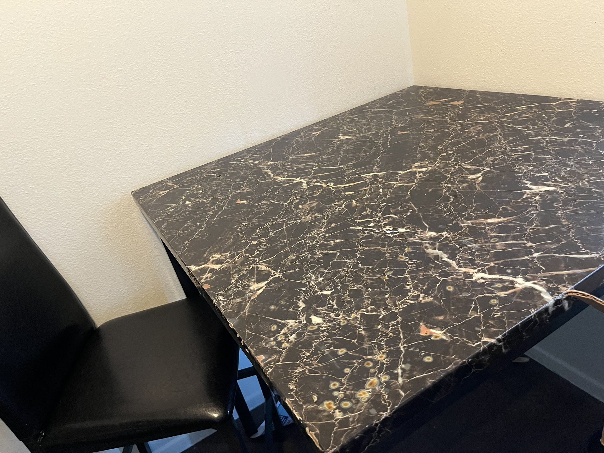 Dining table and two chairs