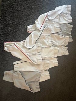 11 pairs baseball practice pants size youth M, all Mizuno except 1 Easton